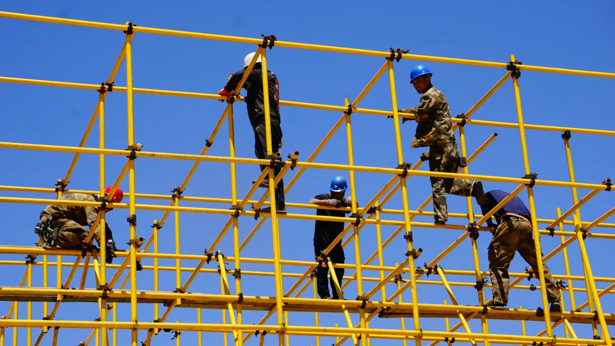 Workers on industrial scaffolding